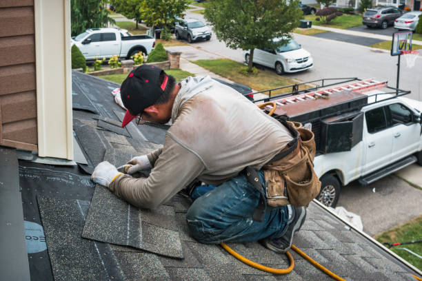 Professional Roof Replacement technician working in Booneville, IA
